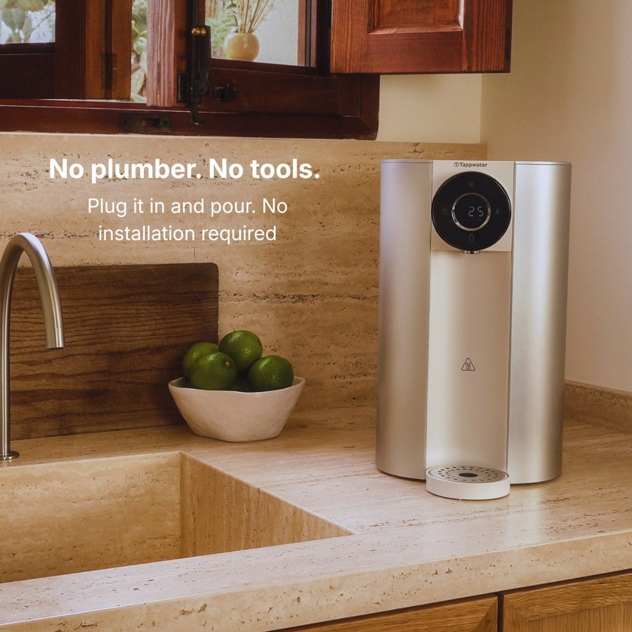 Reverse osmosis benchtop filter on a kitchen bench beside a stone sink — no plumber and no tools, plug in and pour