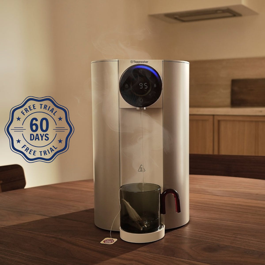Reverse osmosis filter pouring hot water into a mug on a timber table, with a 60 day free trial badge